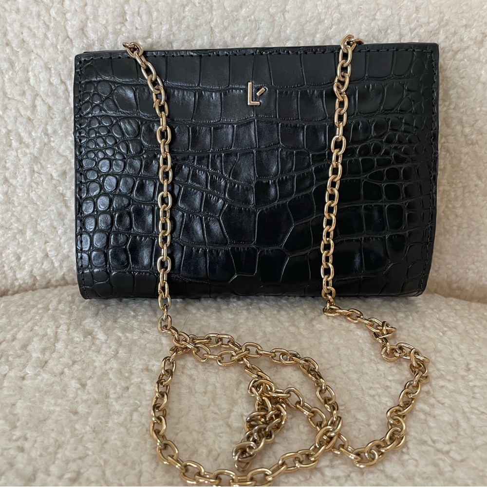 Larroude Erin clutch in black stamped leather